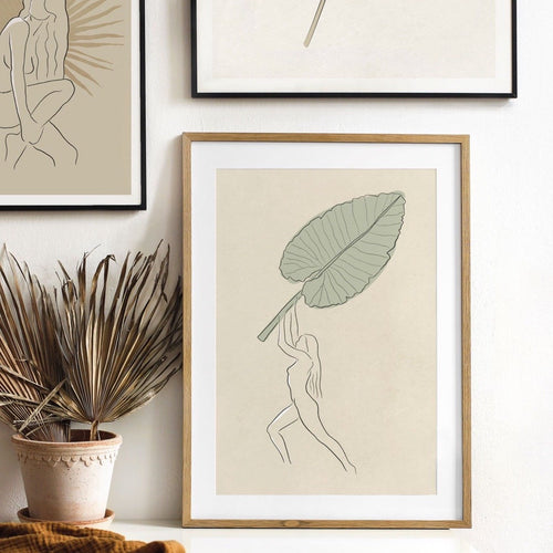 Nude beach girl with tropical palm leaf art print by Megan Heloise